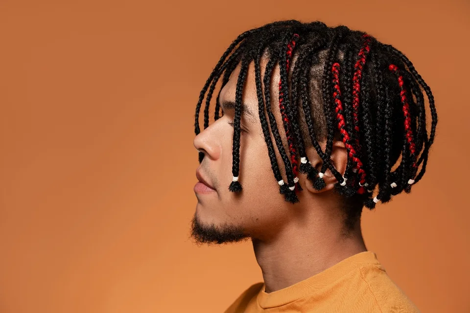 Side profile with short braids and bead details