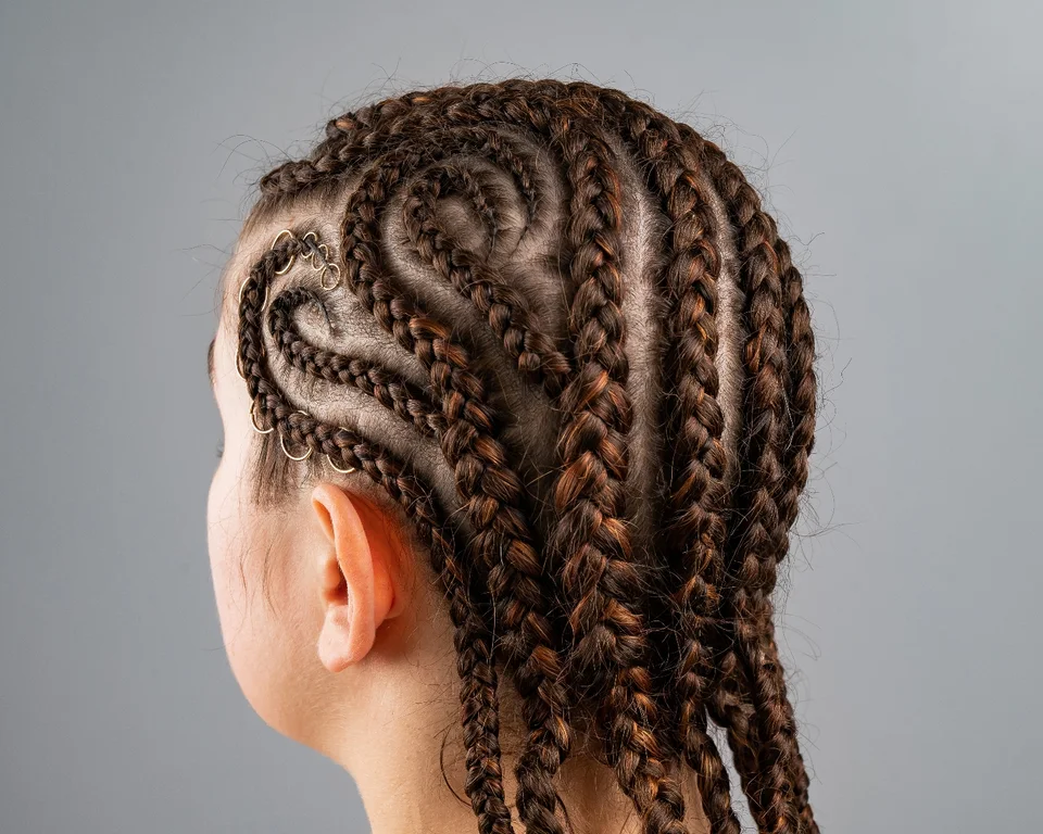 An intricate cornrow braid pattern viewed from behind